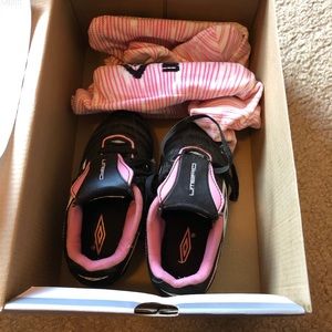 Girls Umbro soccer cleats, shin pads, & socks.
